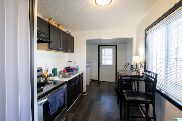 kitchen with a textured ceiling, stainless steel range with electric cooktop, dark hardwood / wood-style floors, and ventilation hood