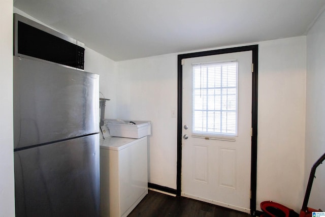 laundry room featuring washer / dryer and dark hardwood / wood-style floors