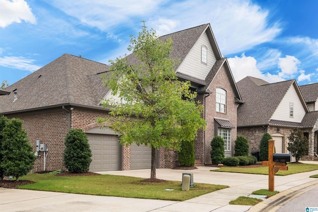 front of property featuring a front yard and a garage