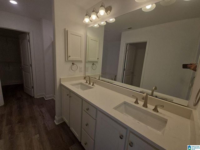 bathroom featuring vanity and hardwood / wood-style floors