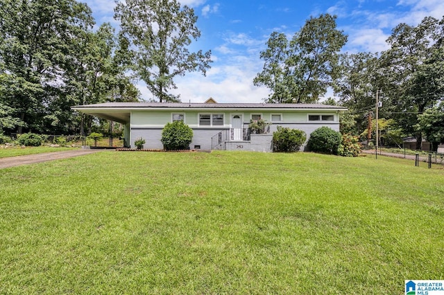 ranch-style home with a front lawn and a carport