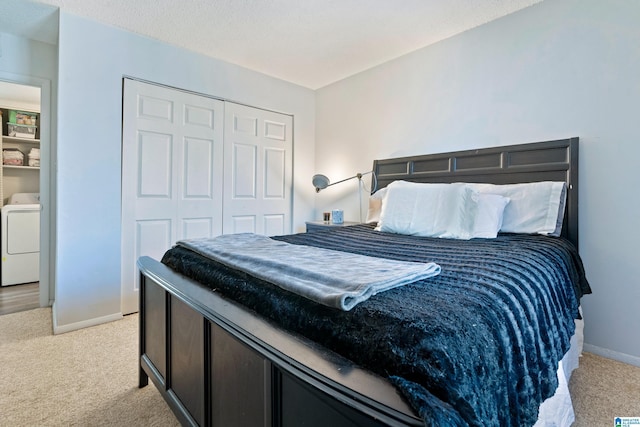 bedroom featuring light colored carpet and a closet