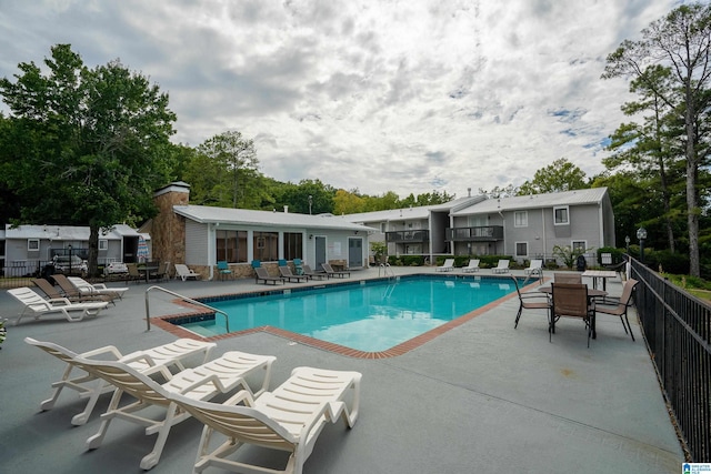 view of swimming pool featuring a patio area