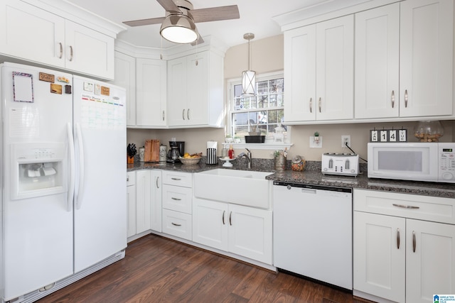 kitchen featuring white appliances, white cabinetry, pendant lighting, and dark hardwood / wood-style floors