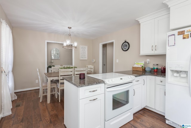 kitchen featuring white appliances, white cabinetry, and dark wood-type flooring