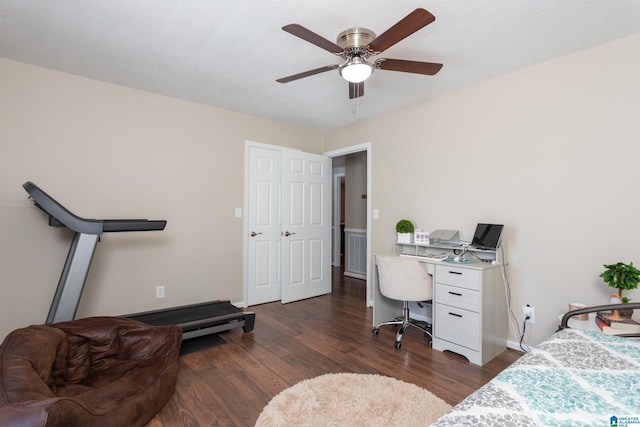 bedroom featuring ceiling fan and dark hardwood / wood-style floors