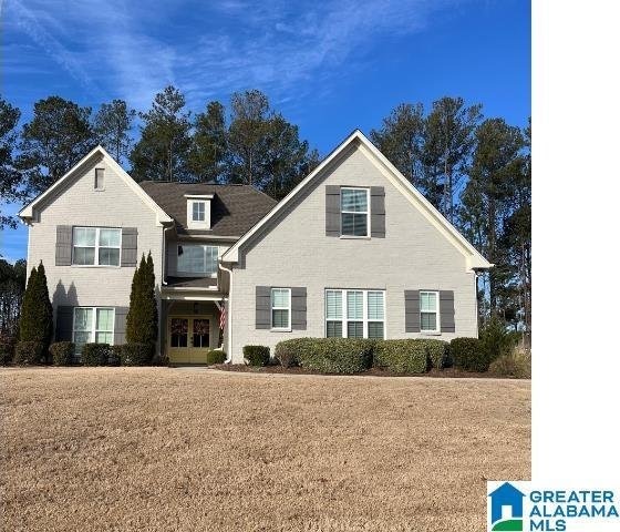 view of property featuring a front yard