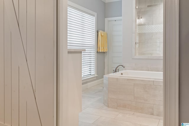 bathroom with tiled tub