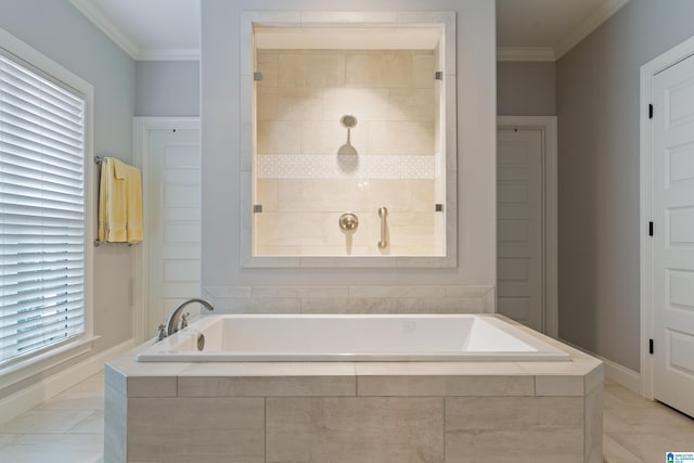 bathroom featuring tiled tub, tile patterned floors, and crown molding