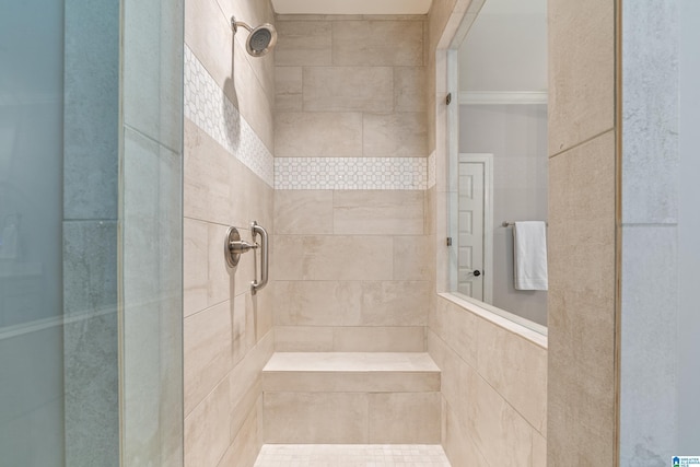 bathroom with tiled shower