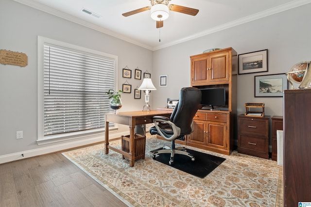 office space featuring ceiling fan, light hardwood / wood-style flooring, and crown molding