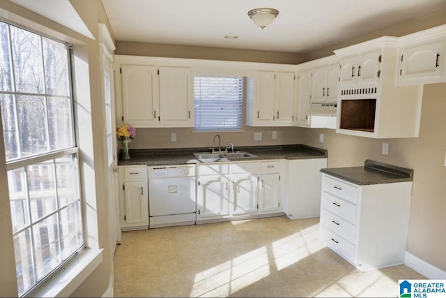 kitchen with white cabinets, dishwasher, a healthy amount of sunlight, and sink