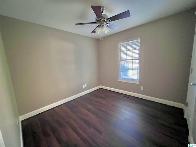 unfurnished room featuring ceiling fan and dark hardwood / wood-style floors