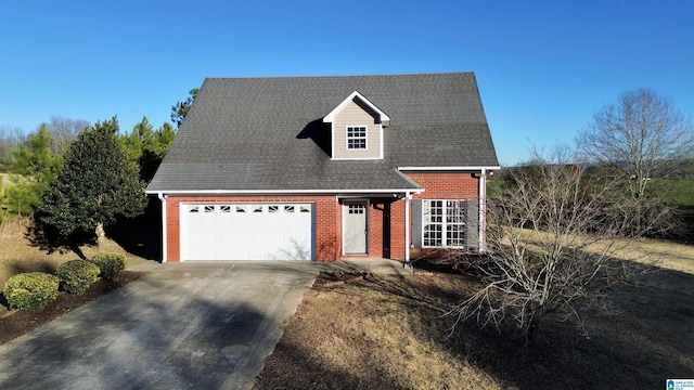 cape cod home featuring a garage