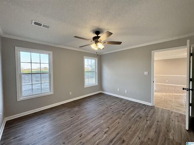 unfurnished room with dark hardwood / wood-style flooring, ceiling fan, a healthy amount of sunlight, and crown molding