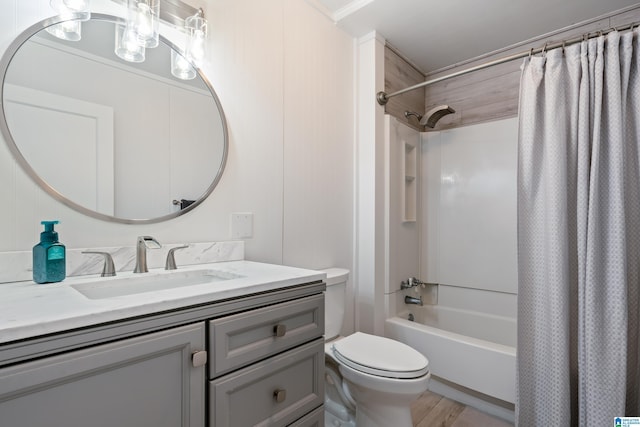 full bathroom with toilet, hardwood / wood-style flooring, shower / bath combination with curtain, and vanity