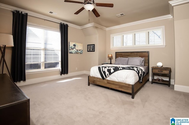 bedroom featuring ceiling fan, light colored carpet, and crown molding