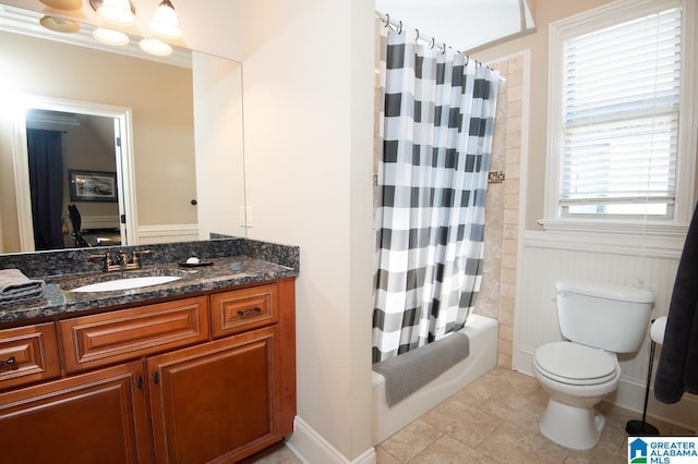 full bathroom with toilet, shower / tub combo, tile patterned flooring, and vanity