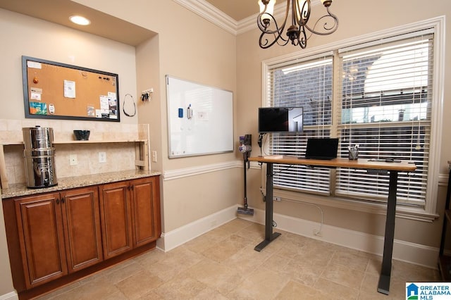 interior space featuring crown molding and a chandelier