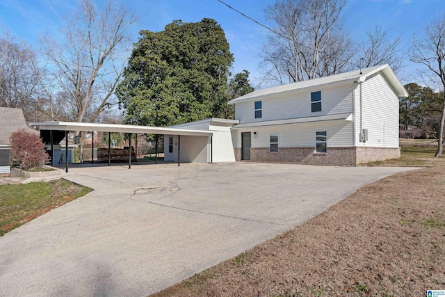 view of front of home with a carport