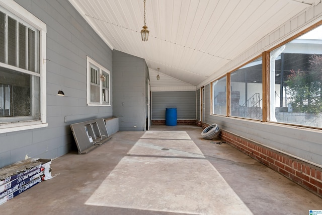 exterior space with vaulted ceiling