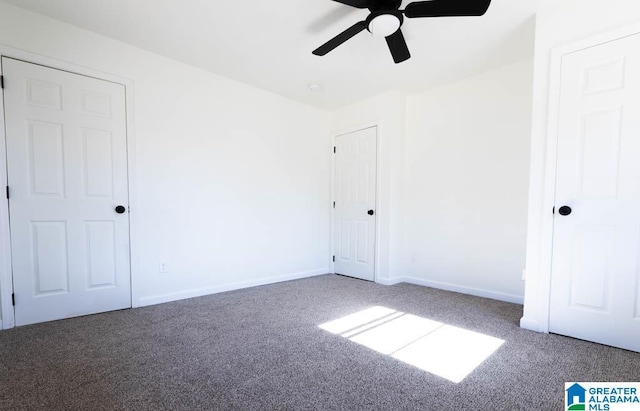 unfurnished bedroom featuring carpet floors and ceiling fan