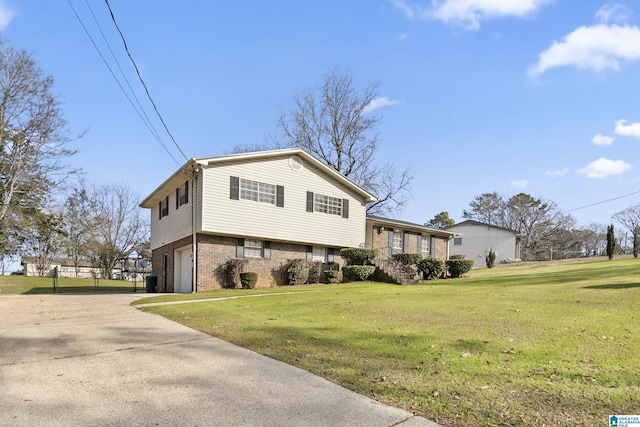 view of front of property with a garage and a front yard