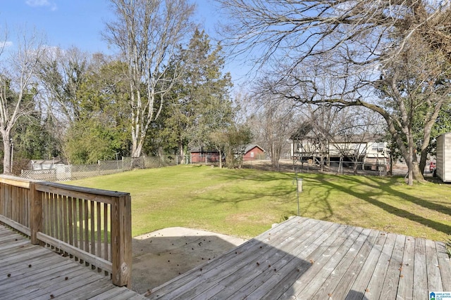 wooden deck with a lawn