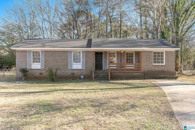 single story home featuring covered porch and a front lawn