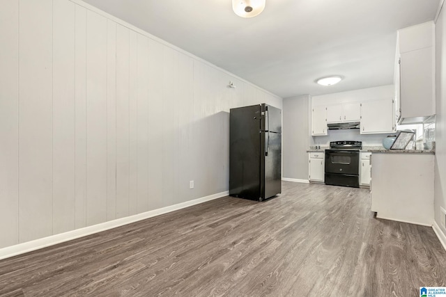 kitchen featuring wood-type flooring, white cabinets, stone countertops, and black appliances