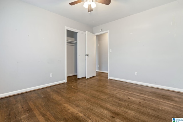 unfurnished bedroom with ceiling fan, a closet, and dark hardwood / wood-style floors