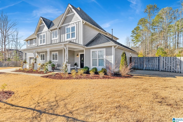 view of front facade featuring a front lawn and covered porch