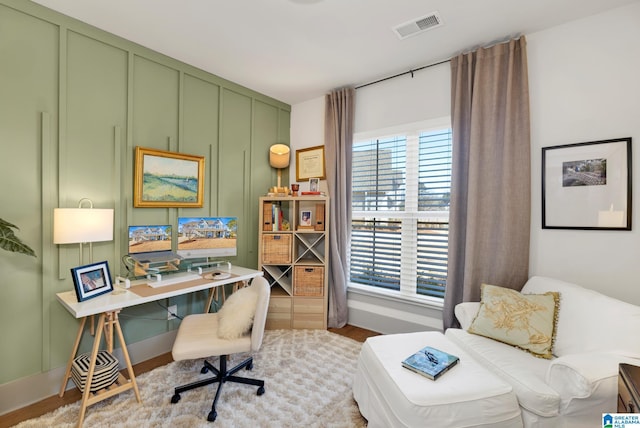 office area with light hardwood / wood-style flooring