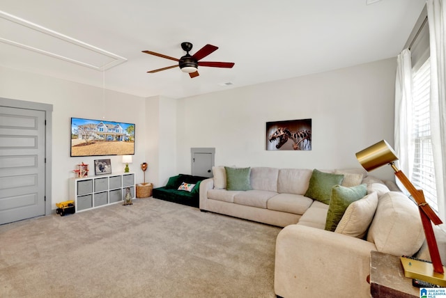 living room featuring ceiling fan and light colored carpet