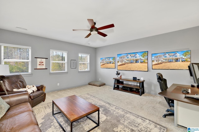 office featuring ceiling fan and light colored carpet