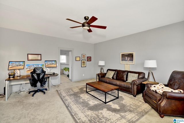 carpeted living room featuring ceiling fan