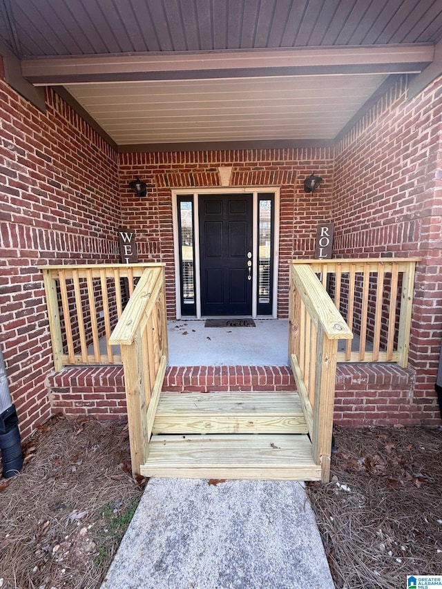 doorway to property featuring covered porch