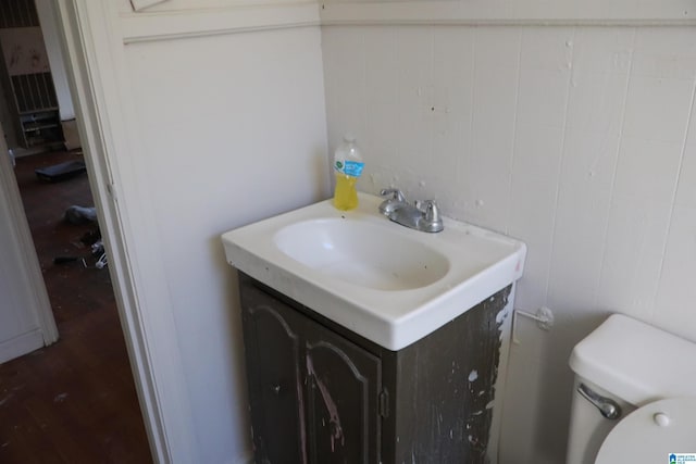 bathroom featuring toilet and vanity