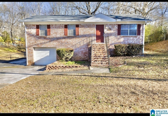 view of front of home with a front lawn and a garage