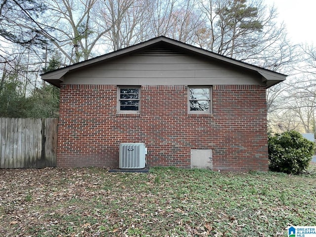 view of side of property featuring central AC unit