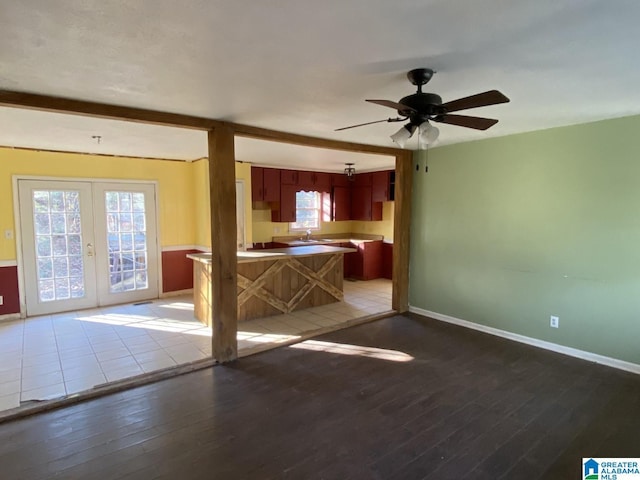 interior space with ceiling fan, french doors, sink, and hardwood / wood-style flooring