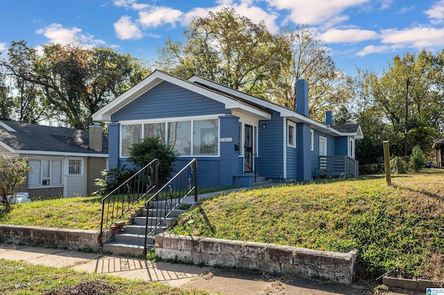 view of front of home with a front lawn