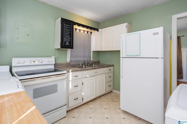 kitchen with a textured ceiling, white cabinetry, sink, and white appliances