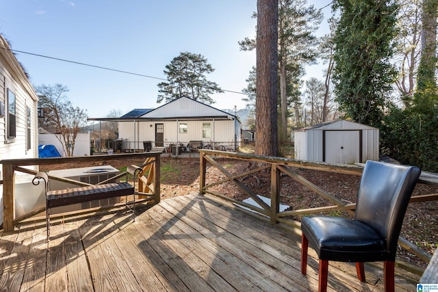 wooden terrace with a storage shed