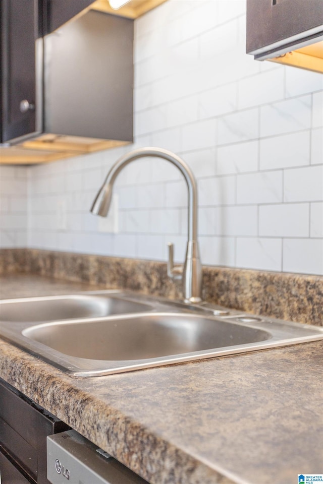 interior details featuring a sink and dark brown cabinets