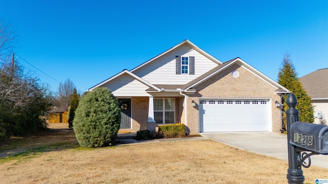 view of front of house featuring a garage, a front lawn, concrete driveway, and brick siding