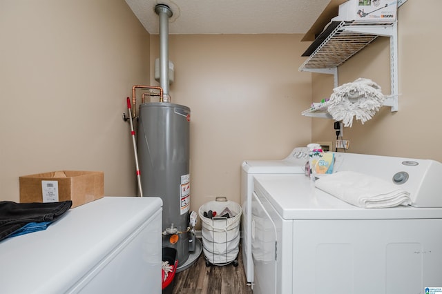 laundry room featuring dark hardwood / wood-style floors, separate washer and dryer, a textured ceiling, and gas water heater