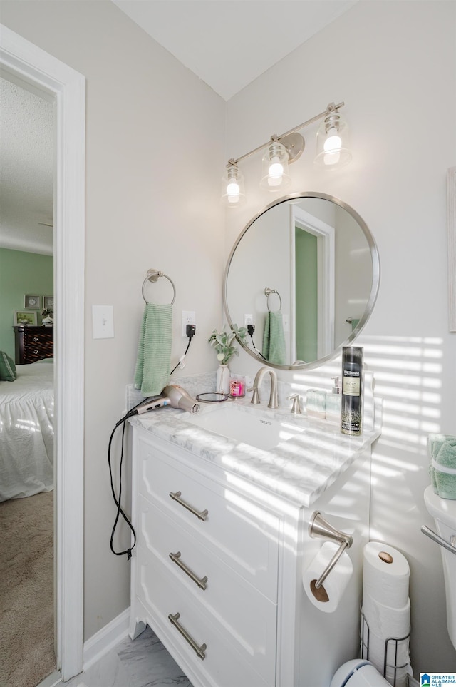 bathroom with toilet and vanity