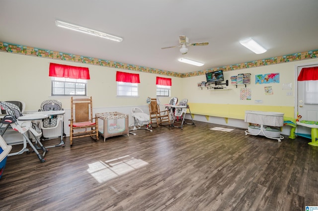 miscellaneous room with ceiling fan and dark hardwood / wood-style flooring