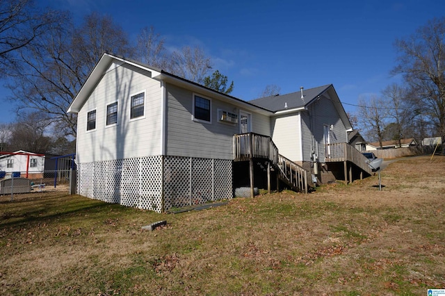 back of property featuring a lawn